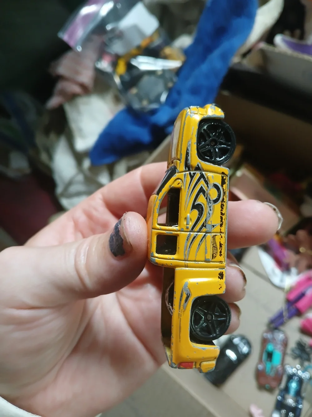 yellow 1:64 scale Hot Wheels Chevy Silverado,